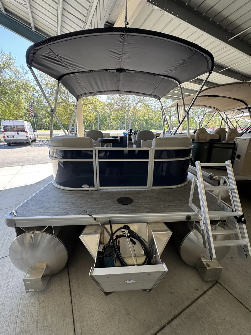 Slide: The Image of Sweetwater EX2086SBX 2026 pontoon boat with canopy and seating area. - 19