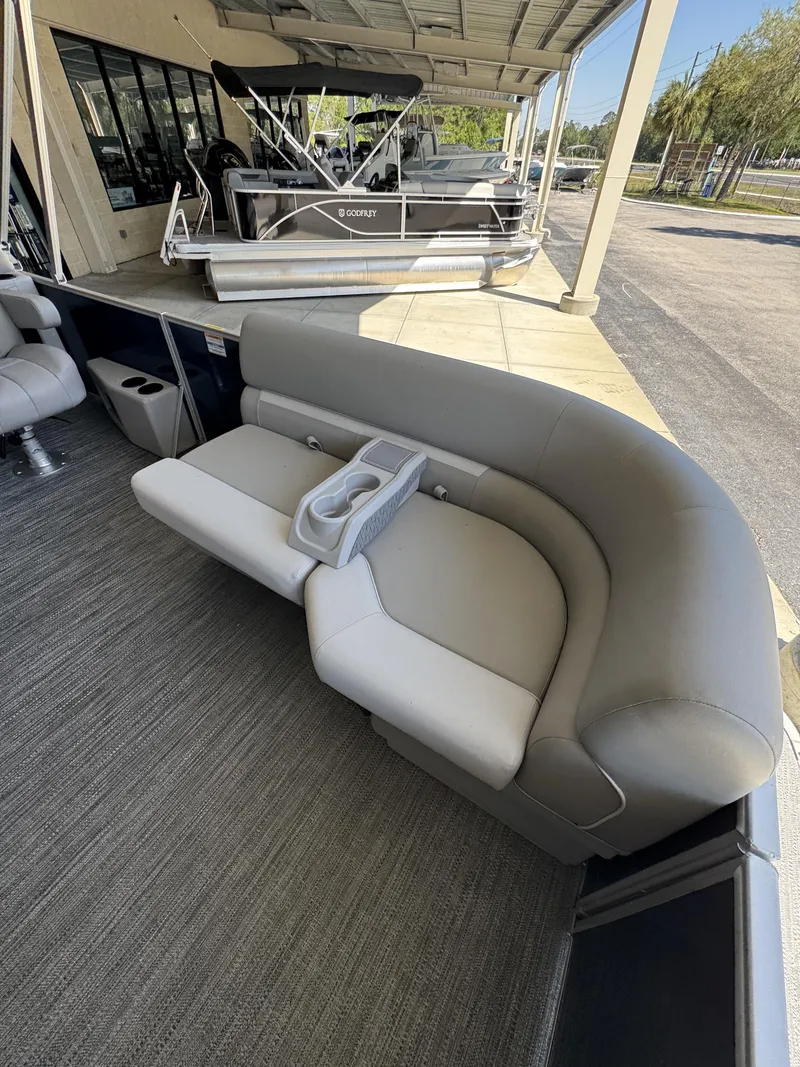 Slide: The Image of Sweetwater EX2086SBX 2026 pontoon boat with gray seating area. - 23