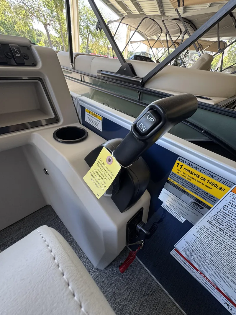 Slide: The Image of Interior of Sweetwater EX2086SBX 2026 with control lever and capacity notice. - 26