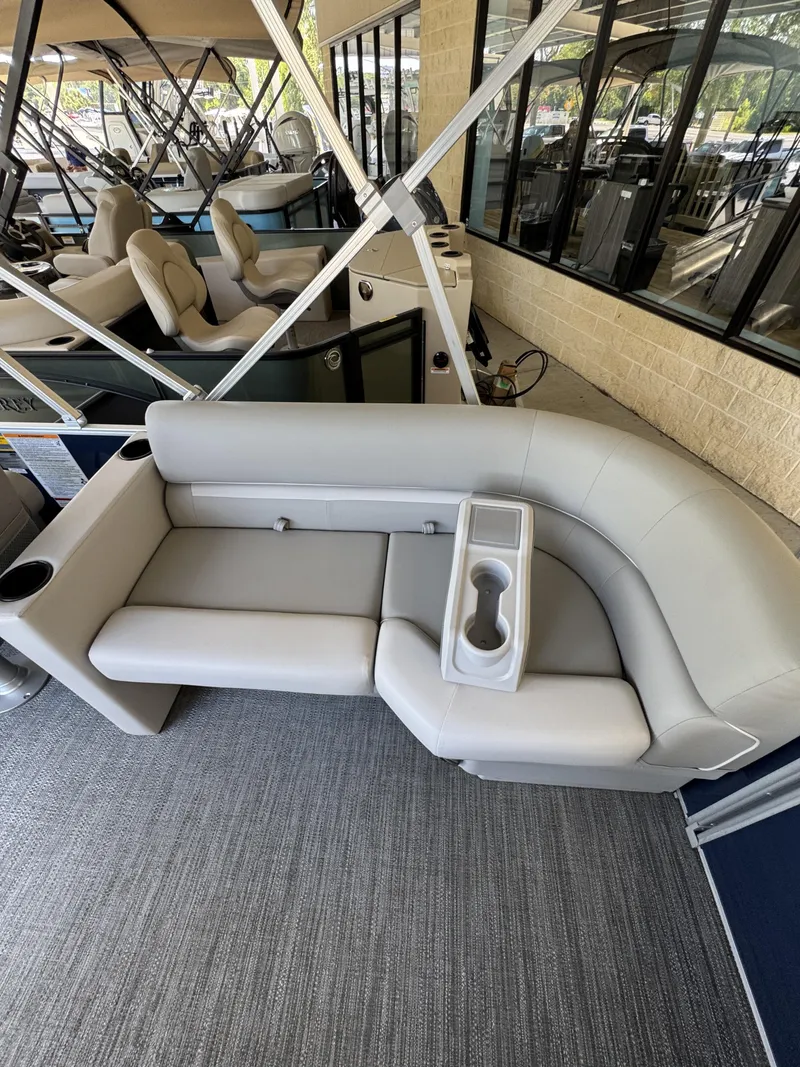 Slide: The Image of Sweetwater EX2086SBX 2026 pontoon boat seating area with cup holders. - 29