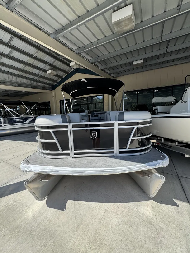 Slide: The Image of 2026 Sweetwater SW2086CSE pontoon boat under covered area. - 16