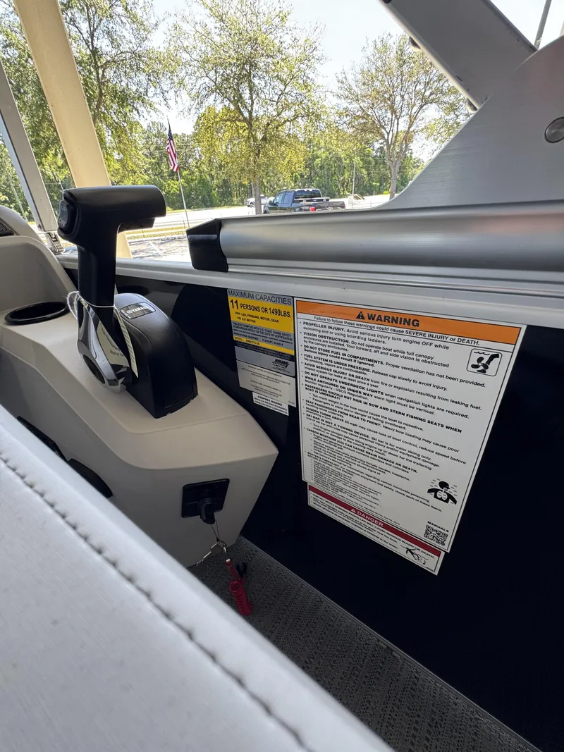 Slide: The Image of Interior view of Sweetwater SW2086CSE boat with warning labels, year 2026. - 25
