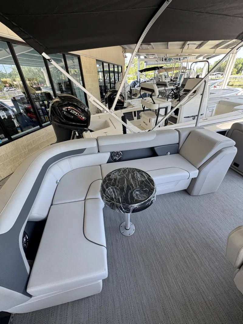Slide: The Image of Interior of a Sweetwater SW2086CSE boat, 2026 model, featuring gray seating. - 27