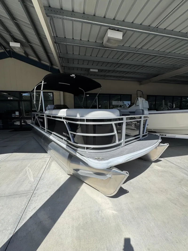 Slide: The Image of 2026 Sweetwater SW2086CSE pontoon boat under canopy. - 3