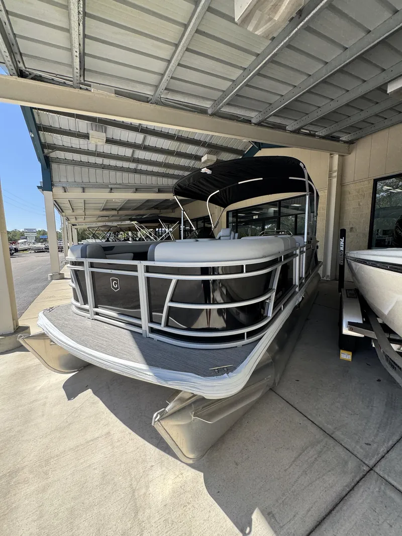 Slide: The Image of 2026 Sweetwater SW2086CSE pontoon boat under covered area. - 4