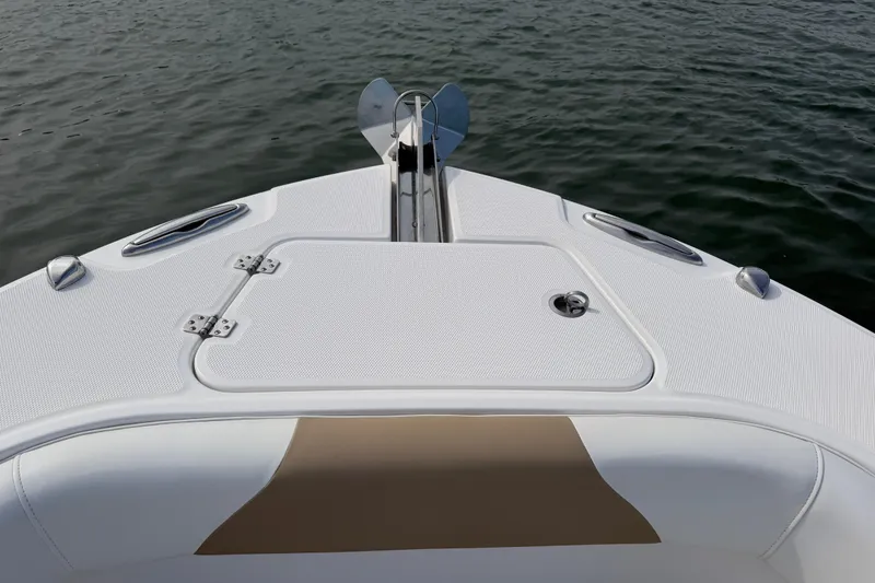 Slide: The Image of Bow of 2021 Edgewater 262CC boat with anchor and storage hatch. - 35
