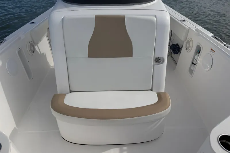 Slide: The Image of 2021 Edgewater 262CC boat interior with white and tan seating, showcasing modern design. - 38