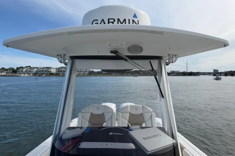Slide: The Image of 2021 Edgewater 262CC boat with Garmin equipment on calm waters. - 40