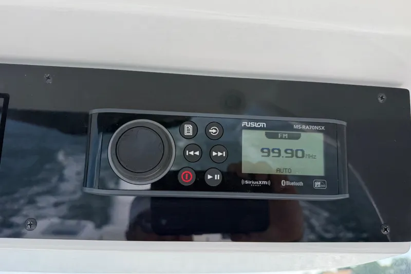 Slide: The Image of Fusion MS-RA70NSX radio display on 2021 Edgewater 262CC boat, tuned to 99.90 MHz FM. - 60