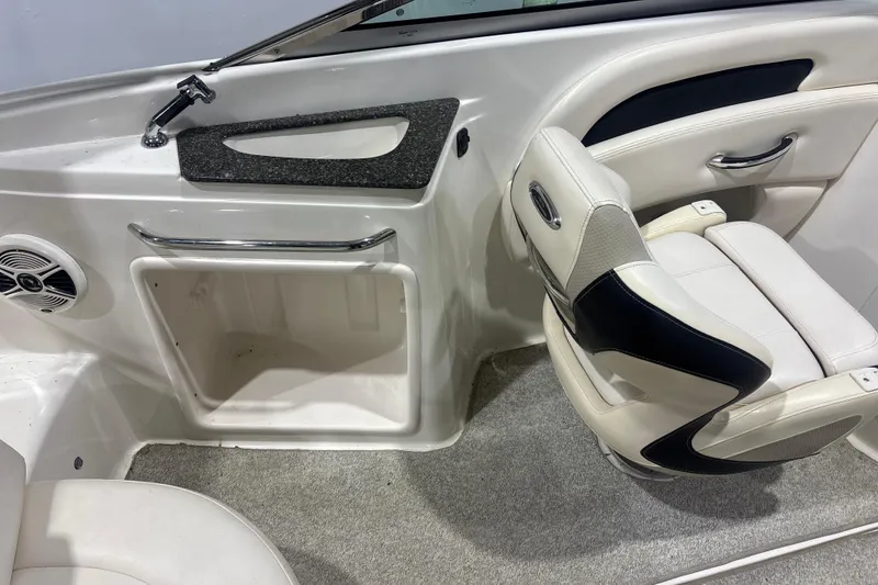 Slide: The Image of Interior of 2009 Chaparral 236 SSX boat with seating and storage compartment. - 10