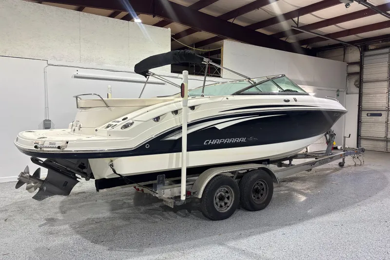 Slide: The Image of 2009 Chaparral 236 SSX boat on trailer in indoor storage facility. - 3