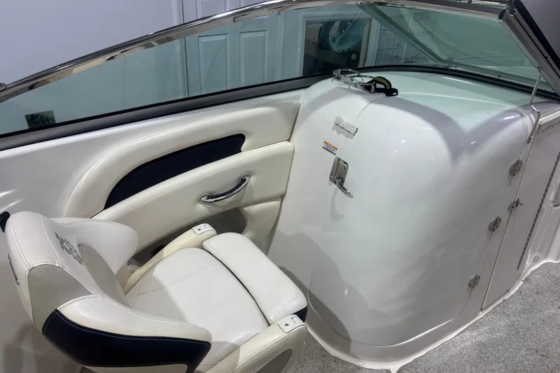 Slide: The Image of Interior of 2009 Chaparral 236 SSX boat with white seating and sleek design. - 8