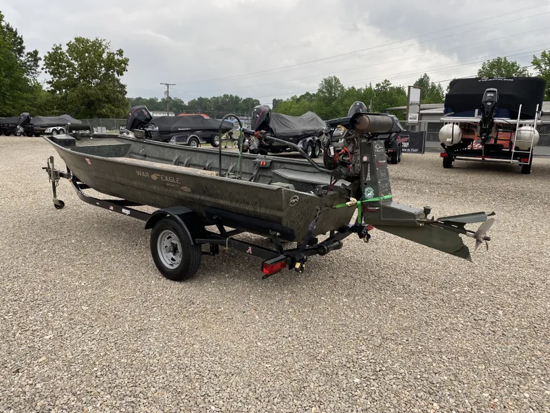 Slide: The Image of 2017 War Eagle 542FLD Sportsman boat on trailer, gravel lot. - 3