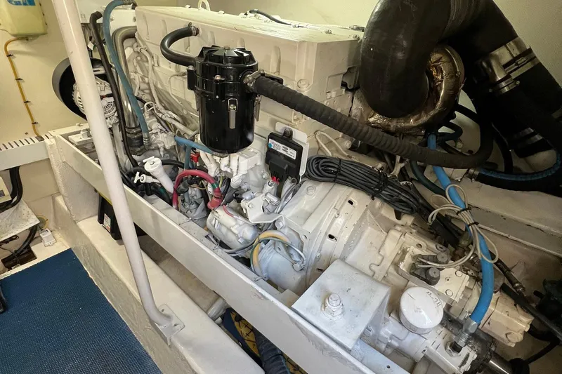 Slide: The Image of Engine room of 2007 Luhrs 41 Hardtop boat, showcasing detailed mechanical components. - 27