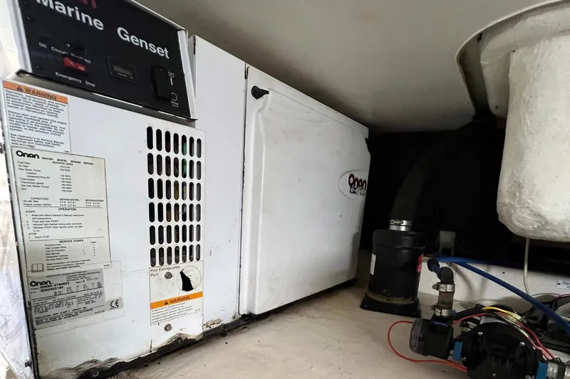 Slide: The Image of 2007 Luhrs 41 Hardtop marine generator and equipment in engine compartment. - 29
