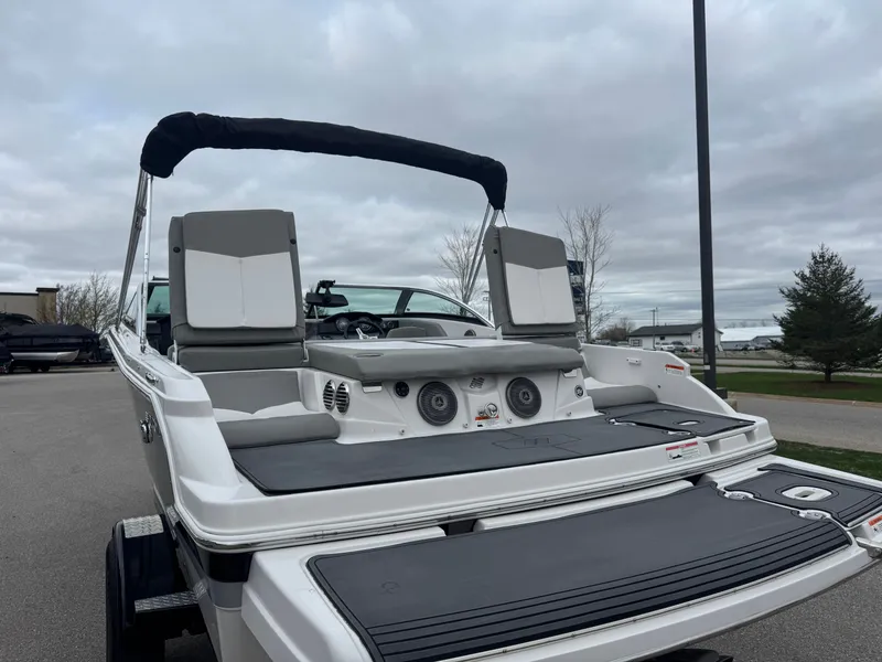 Slide: The Image of 2016 Four Winns 190 Horizon boat with gray seats and speakers. - 13