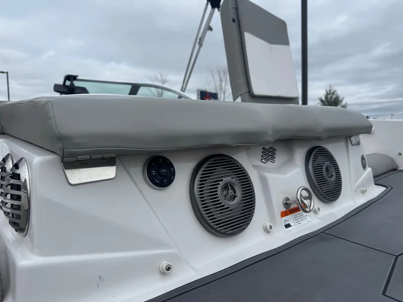 Slide: The Image of 2016 Four Winns 190 Horizon boat with speakers and gray upholstery. - 14