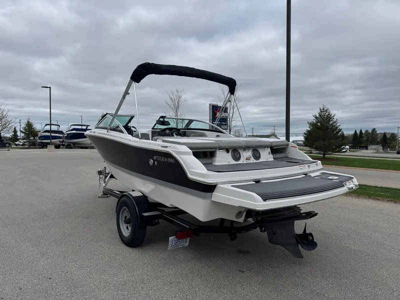 Slide: The Image of 2016 Four Winns 190 Horizon boat on trailer outdoors. - 6