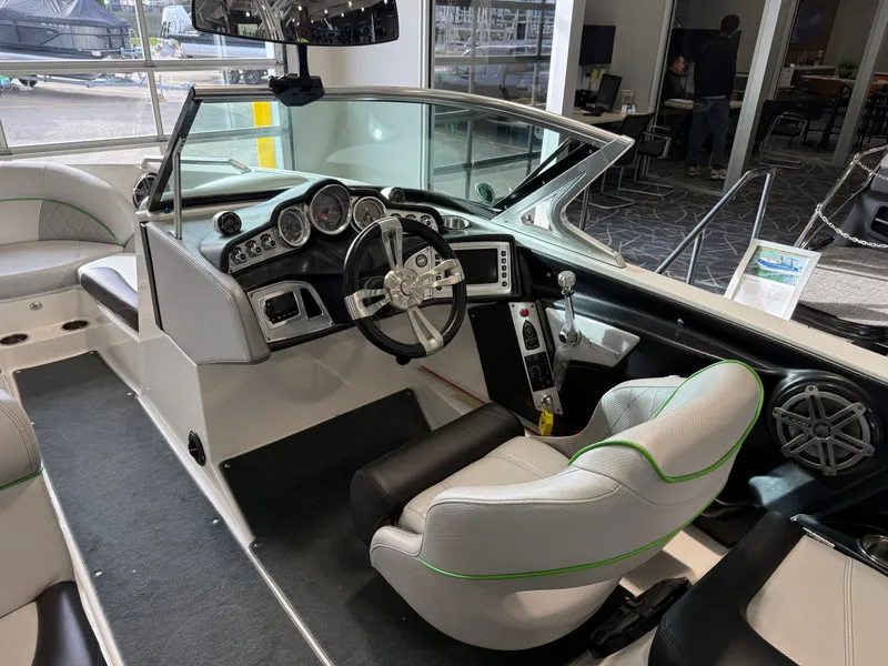 Slide: The Image of Interior of a 2015 MasterCraft X10 boat with modern dashboard. - 11