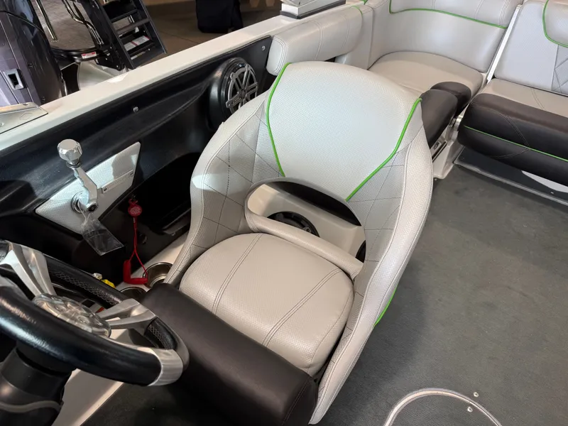 Slide: The Image of Interior of a 2015 MasterCraft X10 boat with gray seating. - 13