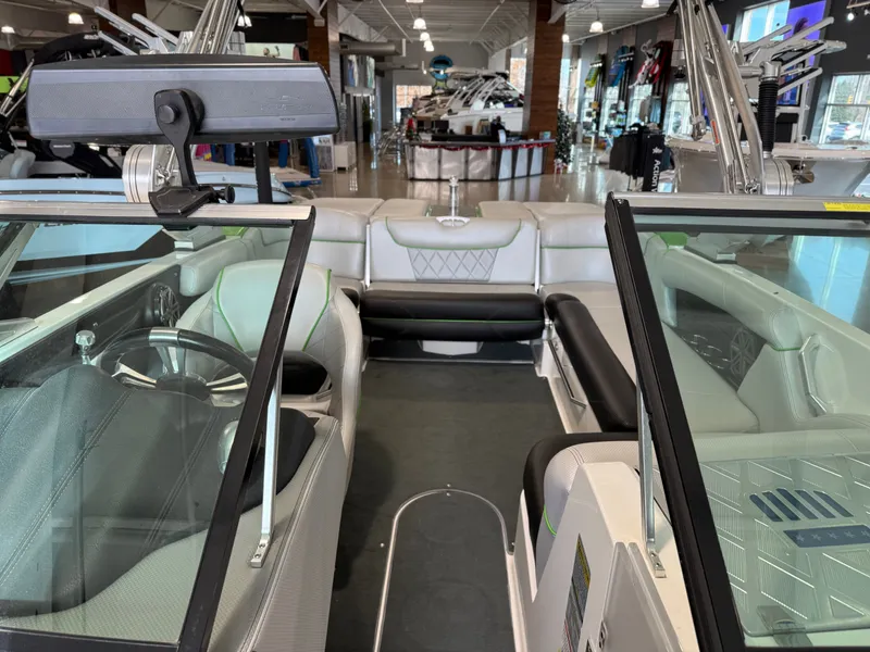 Slide: The Image of Interior view of a 2015 MasterCraft X10 boat in showroom. - 18