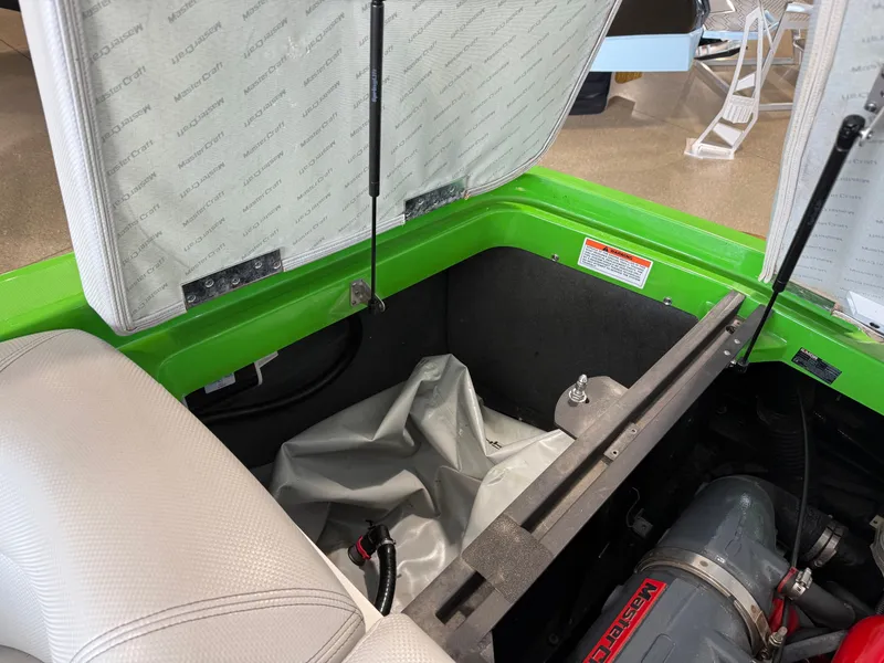 Slide: The Image of Interior view of a 2015 MasterCraft X10 boat with open engine compartment. - 21