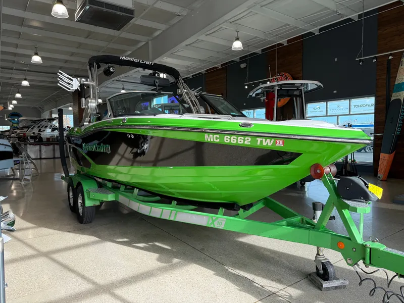 Slide: The Image of Green 2015 MasterCraft X10 boat in showroom. - 5