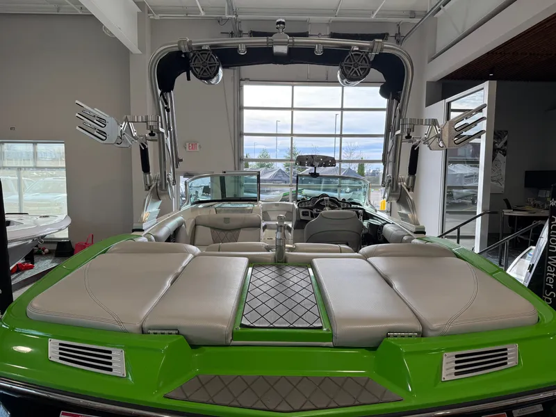 Slide: The Image of 2015 MasterCraft X10 boat with green accents and luxurious interior. - 6