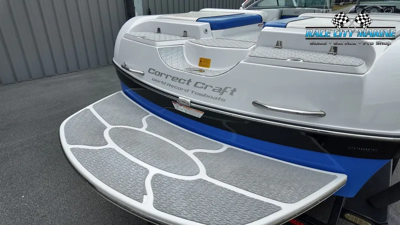 Slide: The Image of 2007 Correct Craft 236TE boat at dock, rear view. - 10