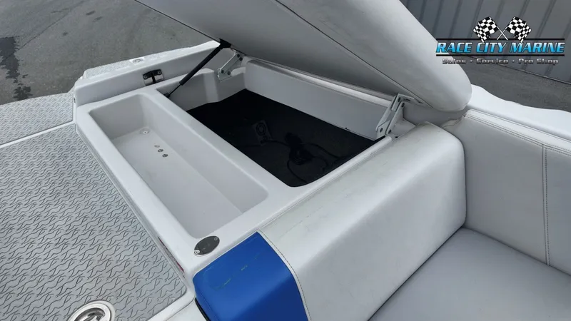 Slide: The Image of 2007 Correct Craft 236TE boat with open storage compartment. - 14