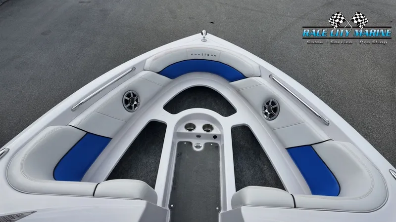 Slide: The Image of Interior of a 2007 Correct Craft 236TE boat with blue and gray seating. - 21
