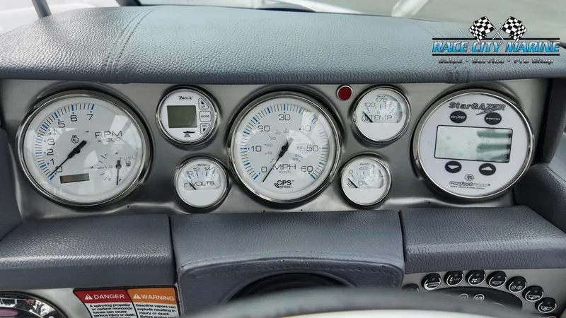 Slide: The Image of Dashboard of a 2007 Correct Craft 236TE boat with various gauges. - 22