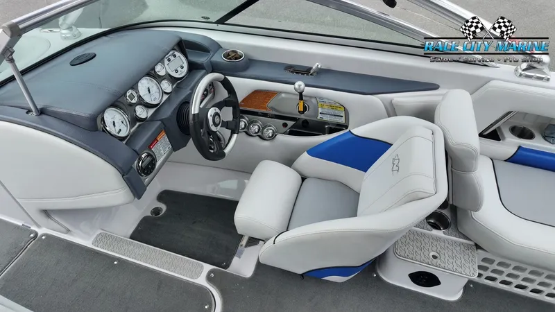 Slide: The Image of Interior of a 2007 Correct Craft 236TE boat with steering console. - 25