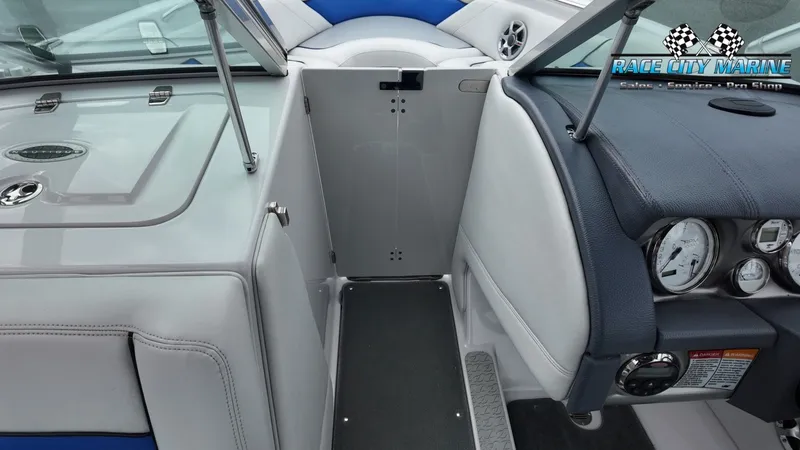 Slide: The Image of Interior of a 2007 Correct Craft 236TE boat with dashboard. - 27