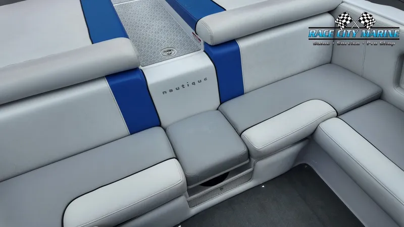 Slide: The Image of Interior of a 2007 Correct Craft 236TE boat with gray and blue seating. - 28