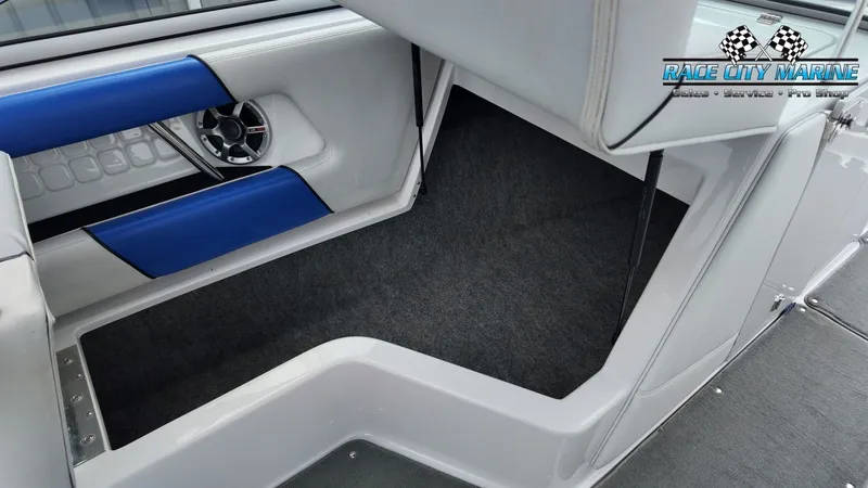 Slide: The Image of Interior of a 2007 Correct Craft 236TE boat with blue accents. - 31