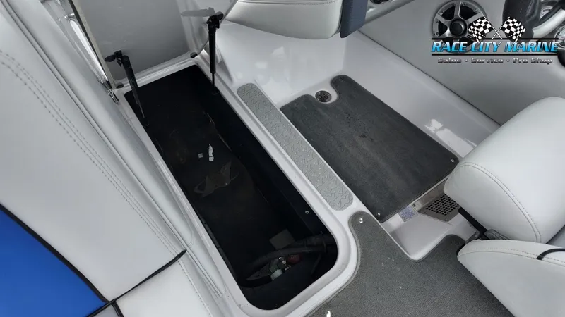 Slide: The Image of Interior of a 2007 Correct Craft 236TE boat with storage compartment. - 33