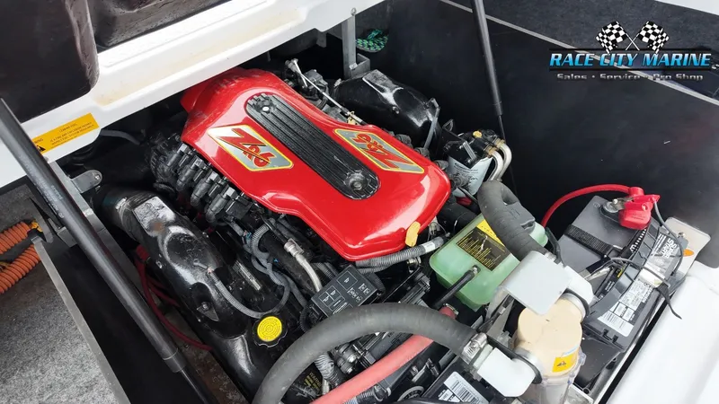 Slide: The Image of Engine of a 2007 Correct Craft 236TE boat, close-up view. - 34