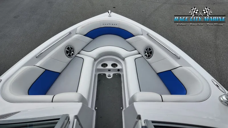 Slide: The Image of Interior of a 2007 Correct Craft 236TE boat with blue and gray seating. - 36