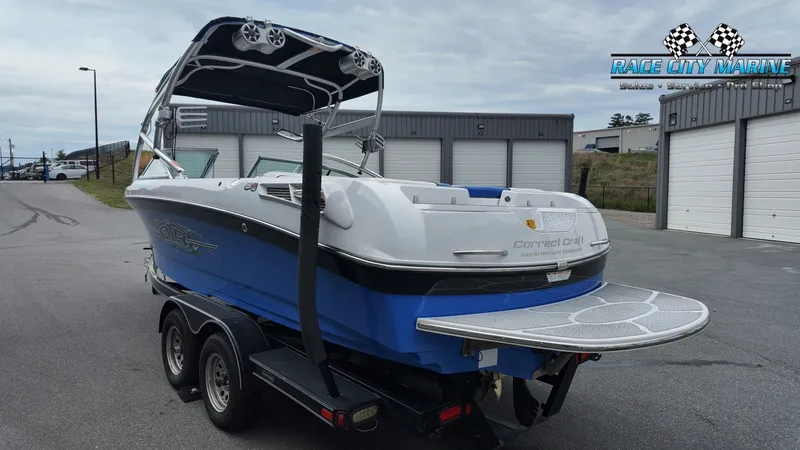 Slide: The Image of 2007 Correct Craft 236TE boat on trailer at Race City Marine. - 7