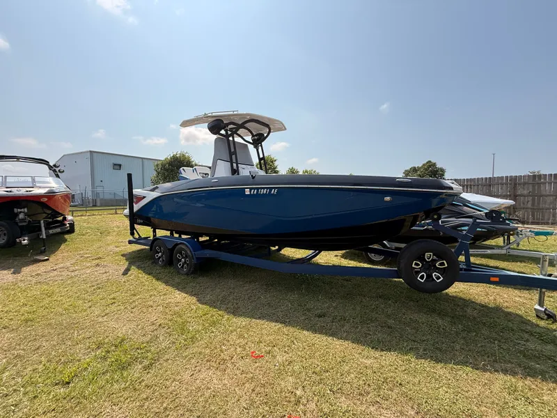 Slide: The Image of 2019 Scarab 255 Open ID boat on trailer outdoors. - 10