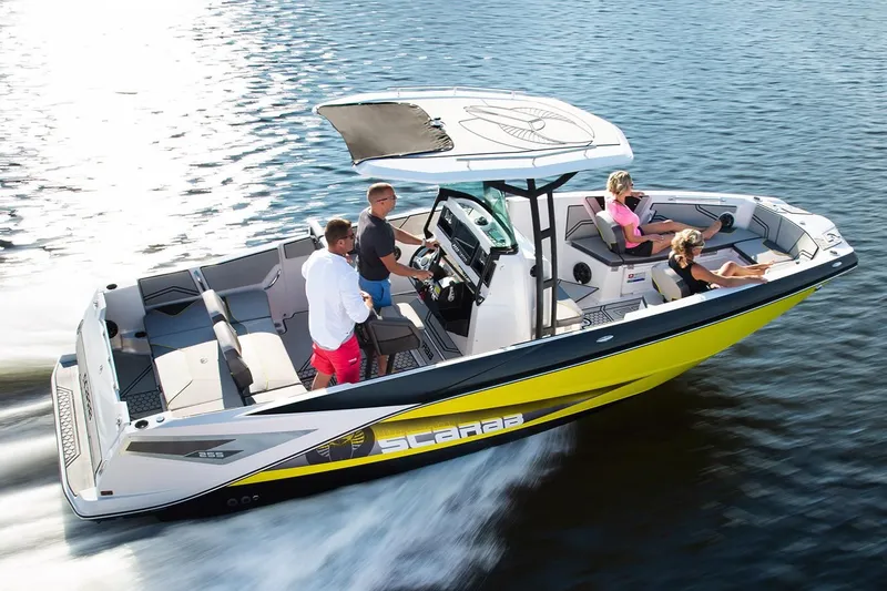 Slide: The Image of 2019 Scarab 255 Open ID boat on water with passengers. - 18