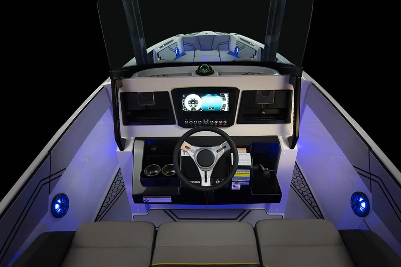 Slide: The Image of Interior view of 2019 Scarab 255 Open ID boat with illuminated cockpit. - 28