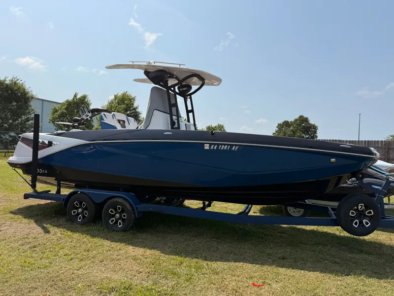 Slide: The Image of 2019 Scarab 255 Open ID boat on trailer outdoors. - 3