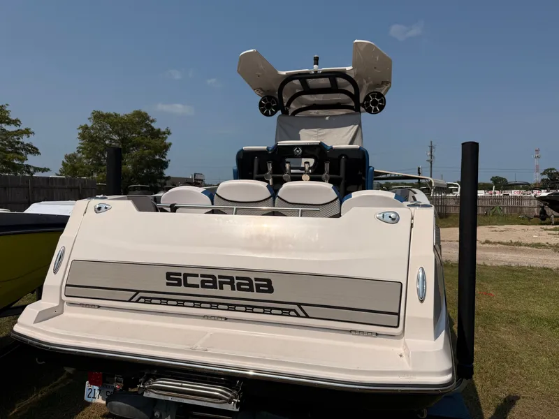 Slide: The Image of 2019 Scarab 255 Open ID boat, rear view outdoors. - 5