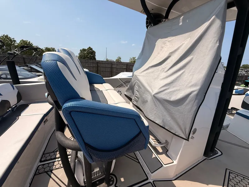 Slide: The Image of Interior of a 2019 Scarab 255 Open ID boat with blue seats. - 8
