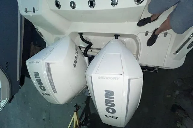 Slide: The Image of 2024 Boston Whaler 280 Outrage with dual Mercury V8 engines, viewed from above. - 12