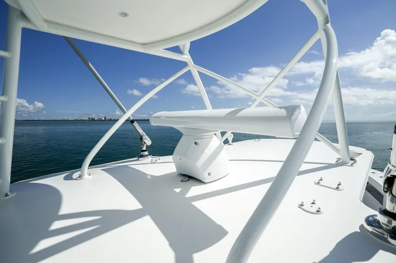 Slide: The Image of 2024 SeaVee 400Z boat deck with radar, ocean view, and clear blue sky. - 19