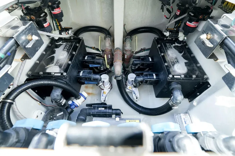 Slide: The Image of Engine compartment of 2024 SeaVee 400Z boat, showcasing mechanical components and wiring. - 20