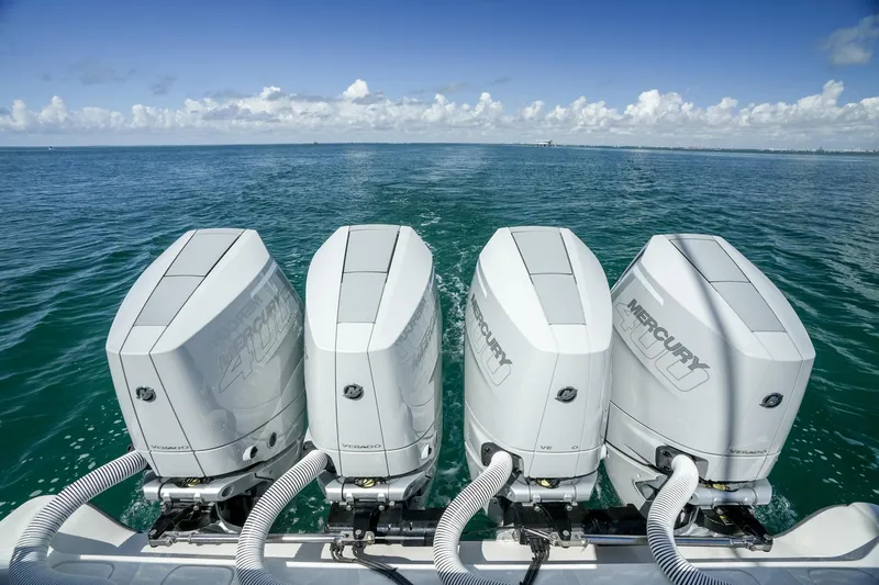 Slide: The Image of 2024 SeaVee 400Z with four powerful Mercury outboard engines on open water. - 21